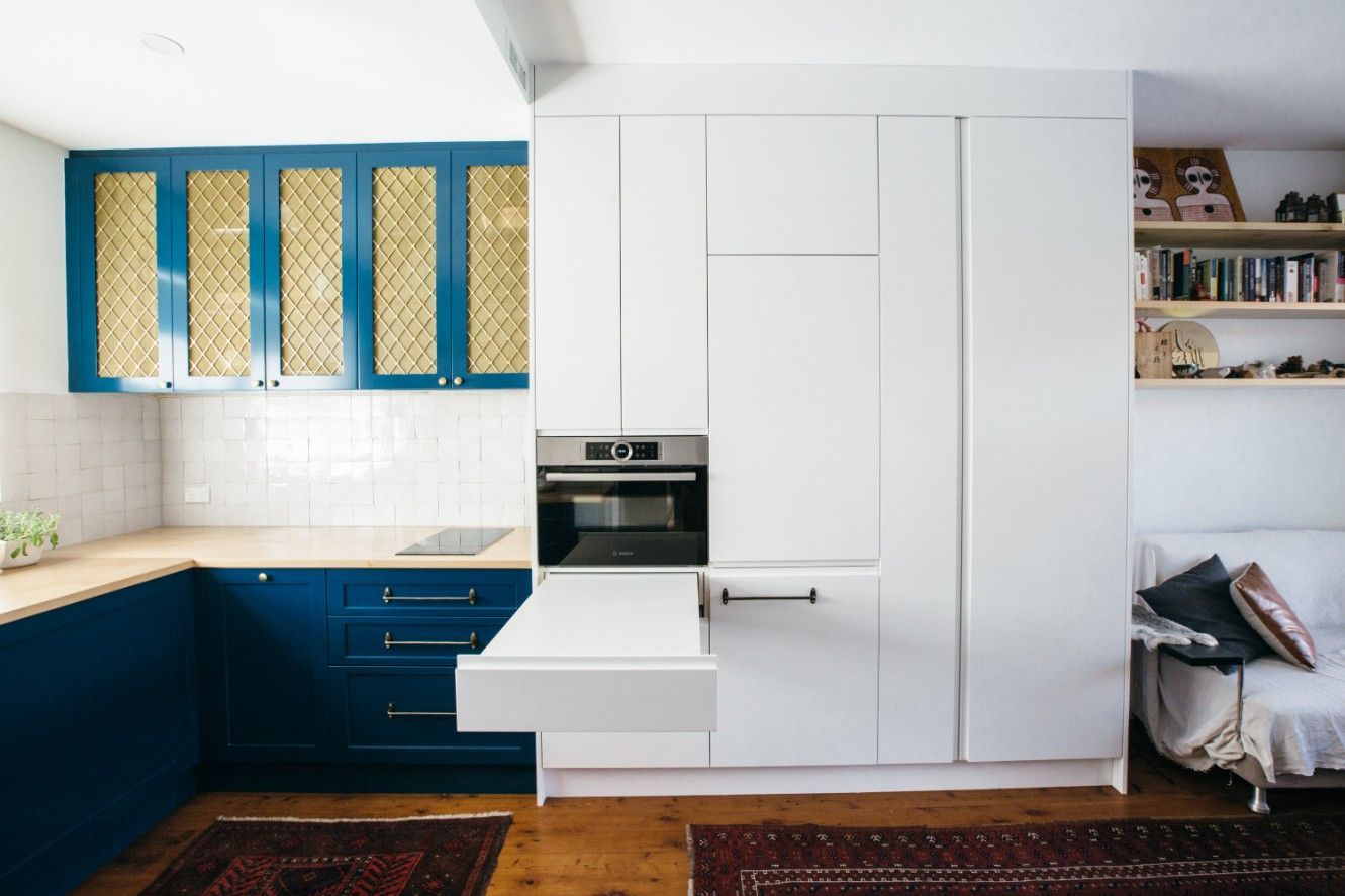 A Pleasant Kitchen With Blue Cabinets And White Cabinets And A Couch In The Background — Concept Kitchens In Port Macquarie, NSW