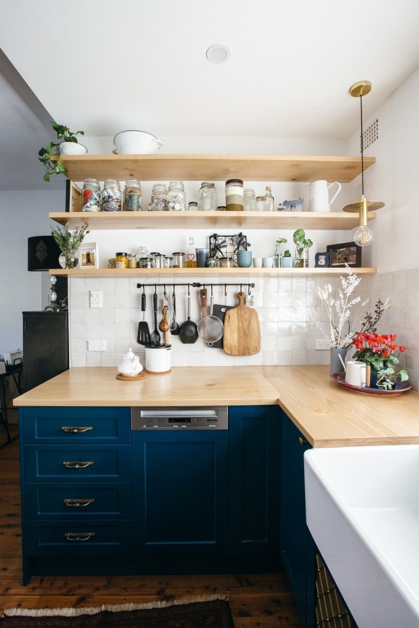 An Organized Kitchen With Blue Cabinets And Gold Meshed Wooden Shelves And A Sink — Concept Kitchens In Port Macquarie, NSW