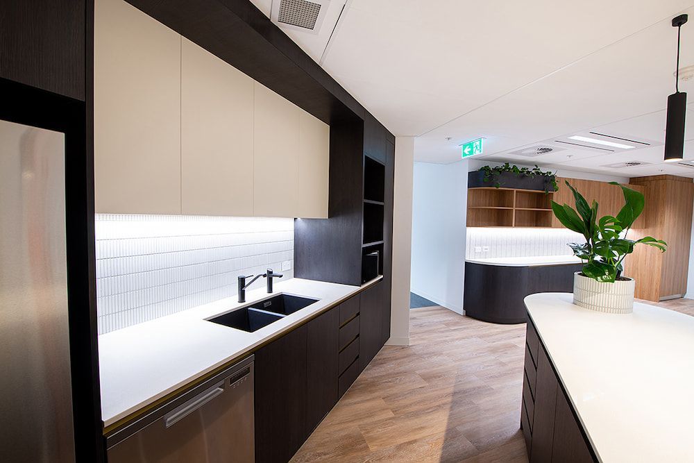 A Kitchen With Stainless Steel Appliances, a Sink, and a Refrigerator — Concept Kitchens In Port Macquarie, NSW