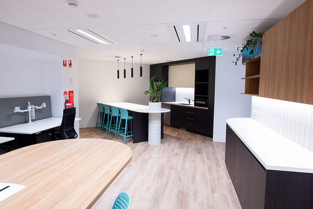 A Large Room With a Table and Chairs in It — Concept Kitchens In Port Macquarie, NSW