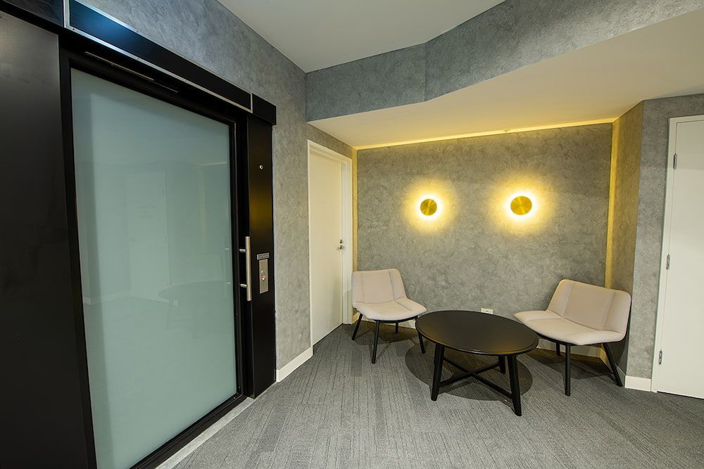 There Are Two Chairs and a Table in the Room — Concept Kitchens In Port Macquarie, NSW