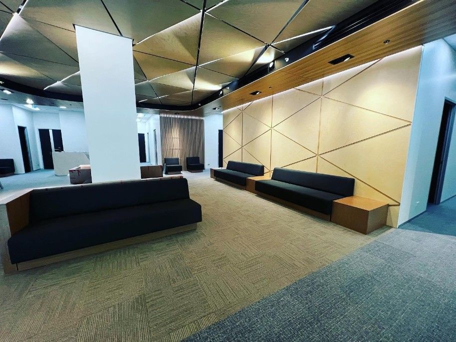 A Waiting Room With A Lot Of Couches And White Post — Concept Kitchens In Port Macquarie, NSW