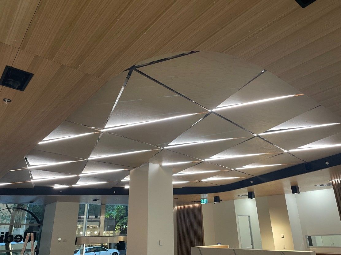 A Room With A Brown Wooden Ceiling And A Lot Of Lights — Concept Kitchens In Port Macquarie, NSW