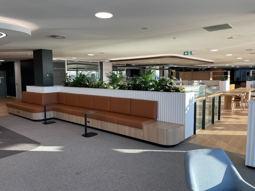 A Large Room With A Couch And Chairs Inside Of It — Concept Kitchens In Port Macquarie, NSW