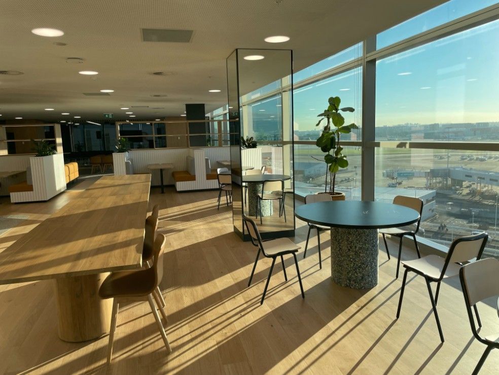 A Large Room With Tables And Chairs In Front Of A Large Window View — Concept Kitchens In Port Macquarie, NSW