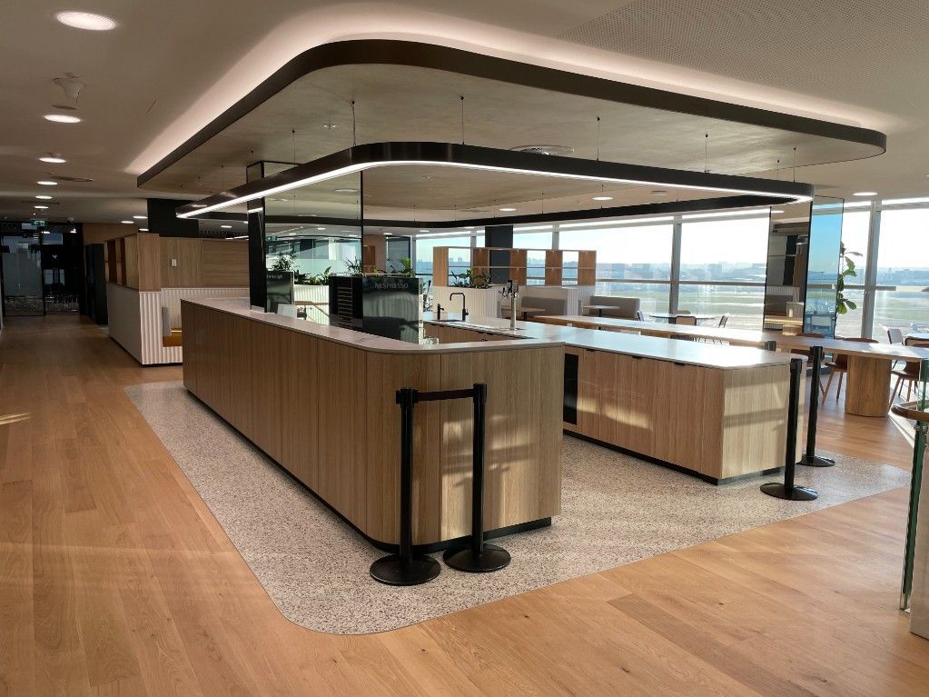 A Large Room With Wooden Floors And Tables And A Large Countertops — Concept Kitchens In Port Macquarie, NSW