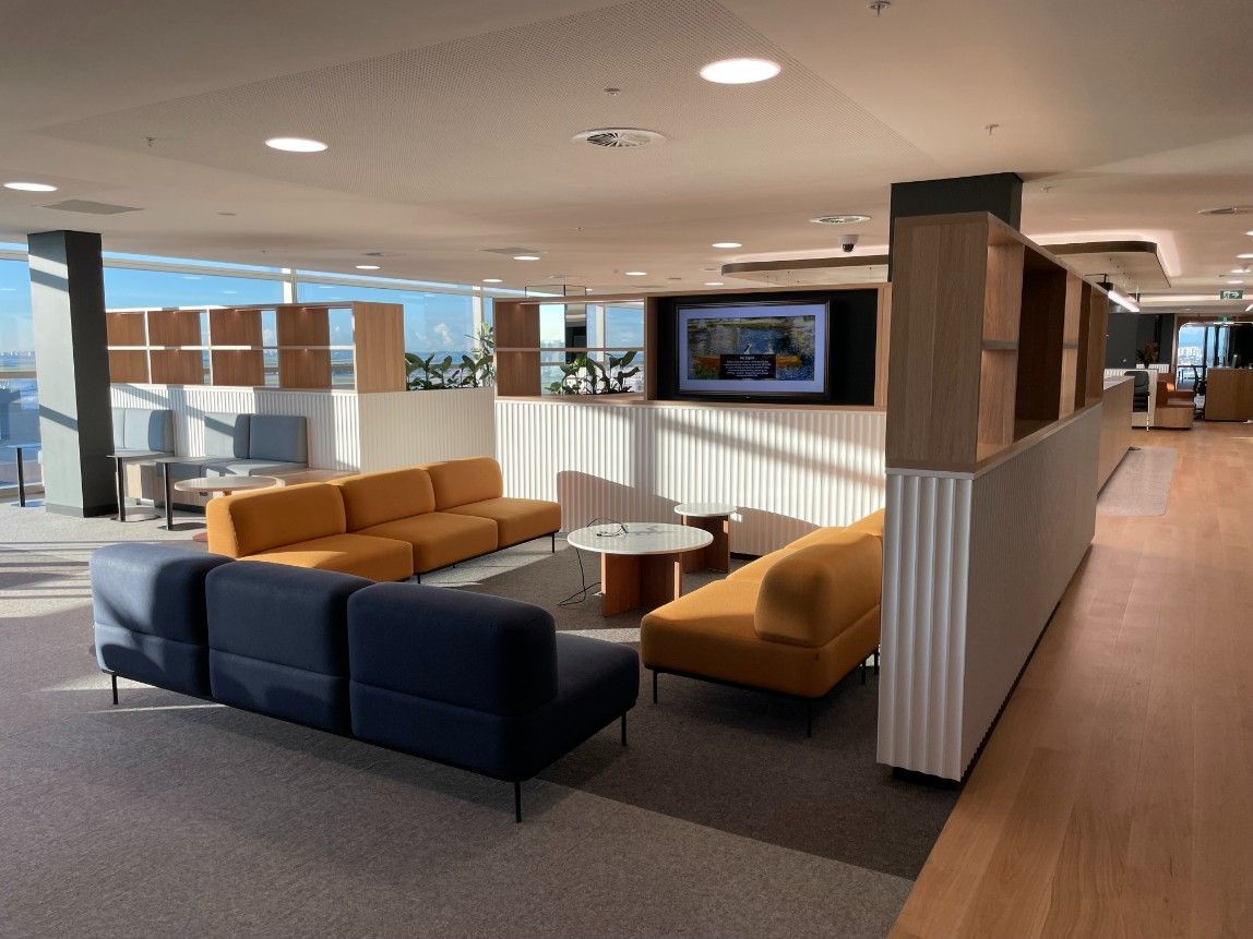 A Living Room With A Lot Of Furniture And Tv — Concept Kitchens In Port Macquarie, NSW