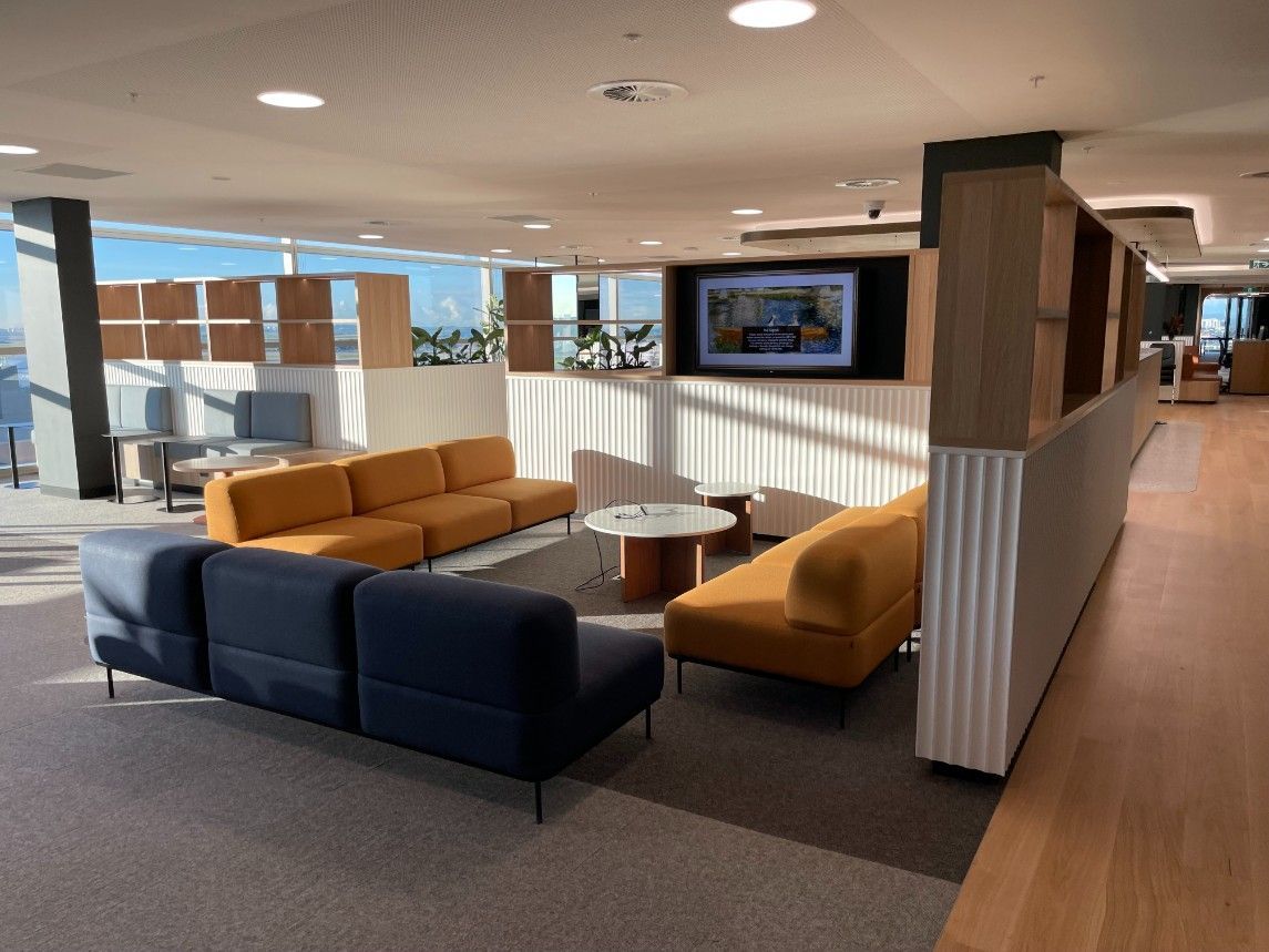 A Living Room With A Lot Of Furniture And A Television On The Wall — Concept Kitchens In Port Macquarie, NSW