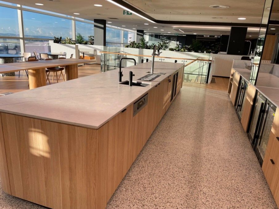 A Long Kitchen With A Lot Of Counter Tops And A Sink — Concept Kitchens In Port Macquarie, NSW