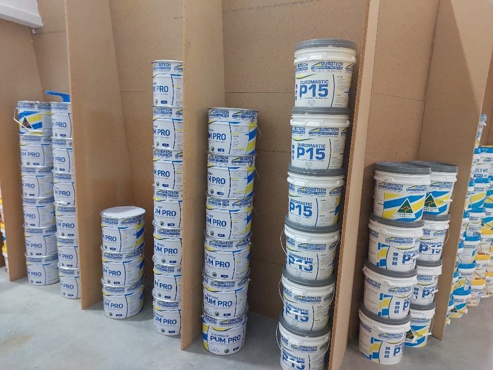 Stacked Buckets of Waterproofing Products — Mid Coast Tile Co in Taree, NSW