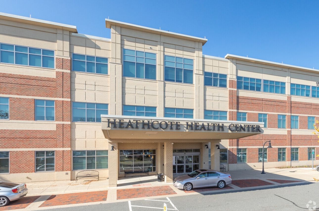 Heathcote Health Center building exterior, with a car parked out front.