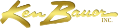 A gold logo for ken bauer inc. on a white background