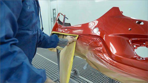 Car bumper after painting in a cars spray booth