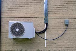 Air,Conditioner,Mini,Split,System,Next,To,Home,With,Painted