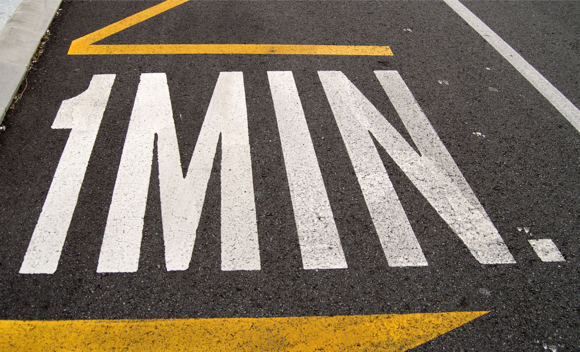 The word 1min is painted on the road