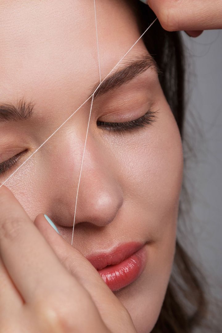 Eyebrow Threading in Progress