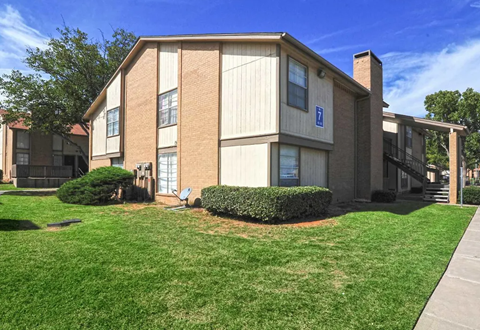 Apartment building with brick and beige siding on a sunny day with green grass and a clear blue sky. Ready to make Southgate Apartment Homes in Odessa, TX your home? Contact us today for more information about our pet-friendly 1, 2, and 3-bedroom apartment homes. Our community offers all the comfort and conveniences you’ll need and a prime location. We can’t wait to welcome you home!