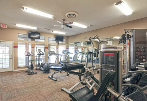 Gym interior with exercise machines, mirrors, and televisions. Ready to make Southgate Apartment Homes in Odessa, TX your home? Contact us today for more information about our pet-friendly 1, 2, and 3-bedroom apartment homes. Our community offers all the comfort and conveniences you’ll need and a prime location. We can’t wait to welcome you home!