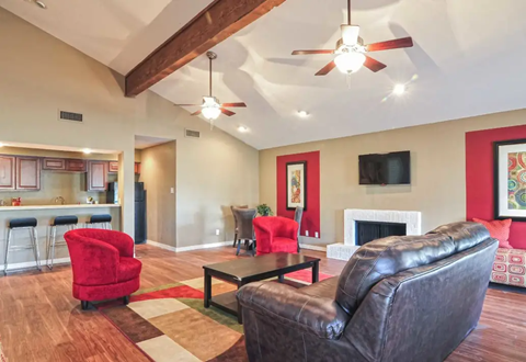Resident club house with red chairs, brown leather sofa, fireplace, and open kitchen. Ready to make Southgate Apartment Homes in Odessa, TX your home? Contact us today for more information about our pet-friendly 1, 2, and 3-bedroom apartment homes. Our community offers all the comfort and conveniences you’ll need and a prime location. We can’t wait to welcome you home!