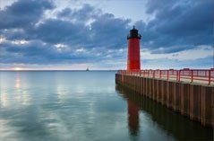 Red Light House Overlooking Calm Water