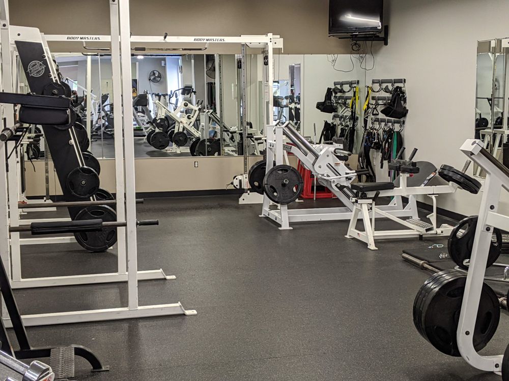 Squat machines at Prestige Fitness Club in Pass Christian, MS