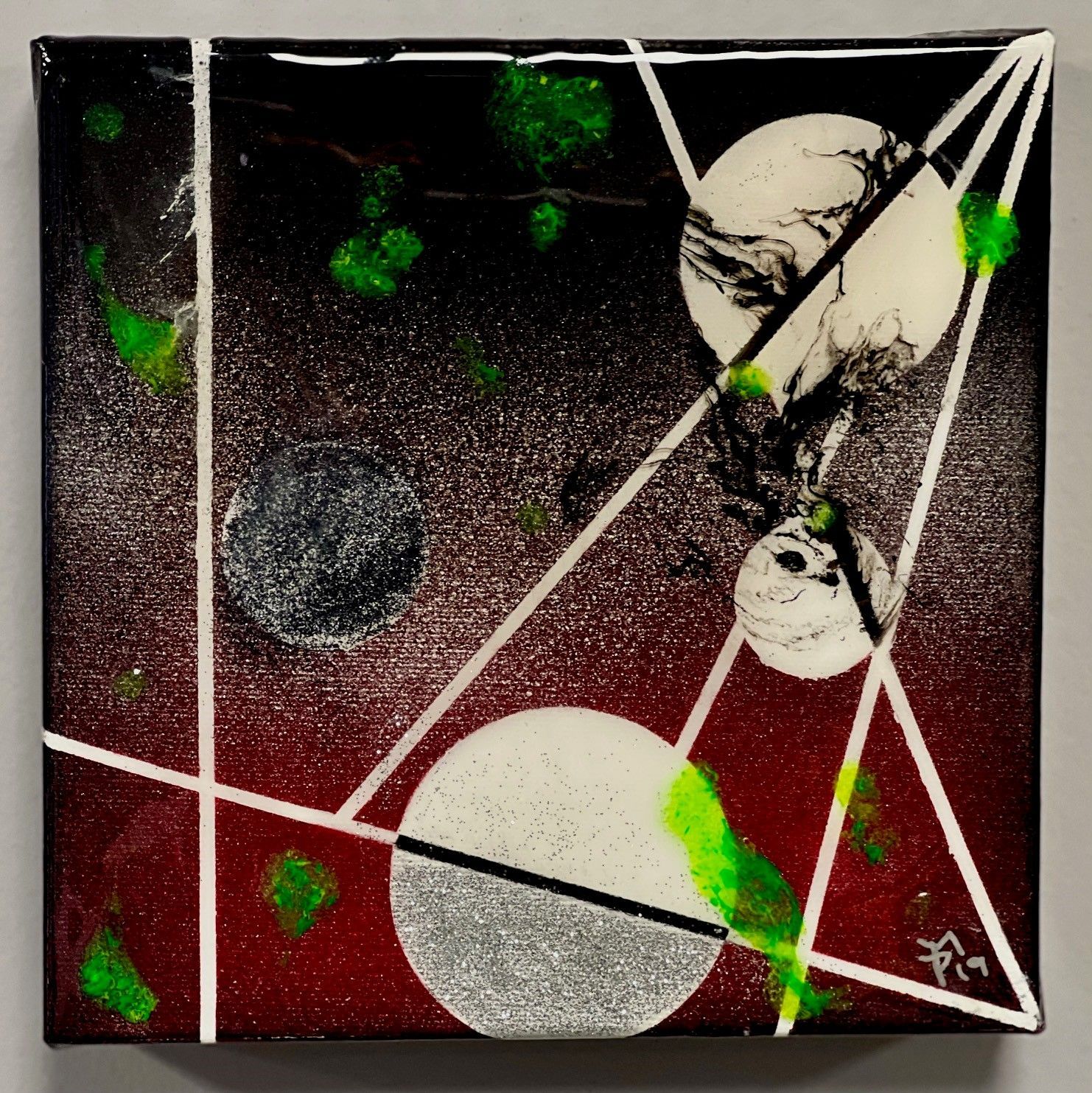 A painting on a canvas with the letters fm on it