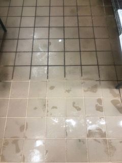 There is a before and after picture of a tiled floor.