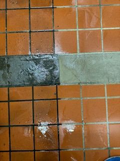 There is a before and after picture of a tile floor.