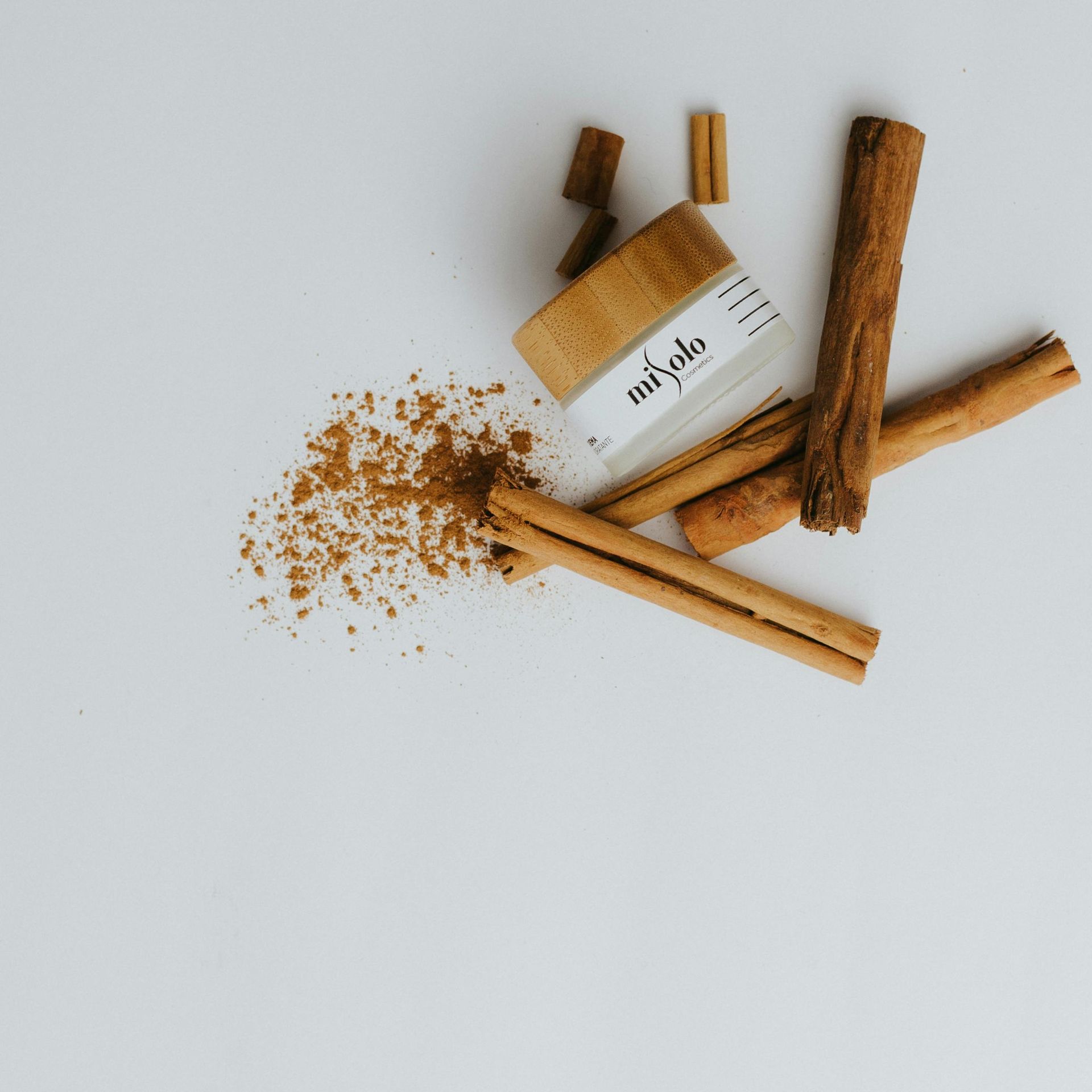 Some cinnamon sticks and a bottle that says sai palo
