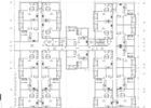 Architectural floor plan of a multi-unit building layout with rooms, doors, and measurements.
