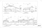 Architectural drawings of building sections. The buildings have varying rooflines and window placements.