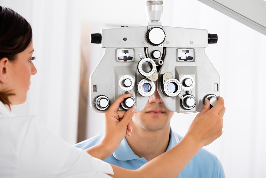 Eye Exam — Man Undergoing in a Eye Exam in Springdale, AR