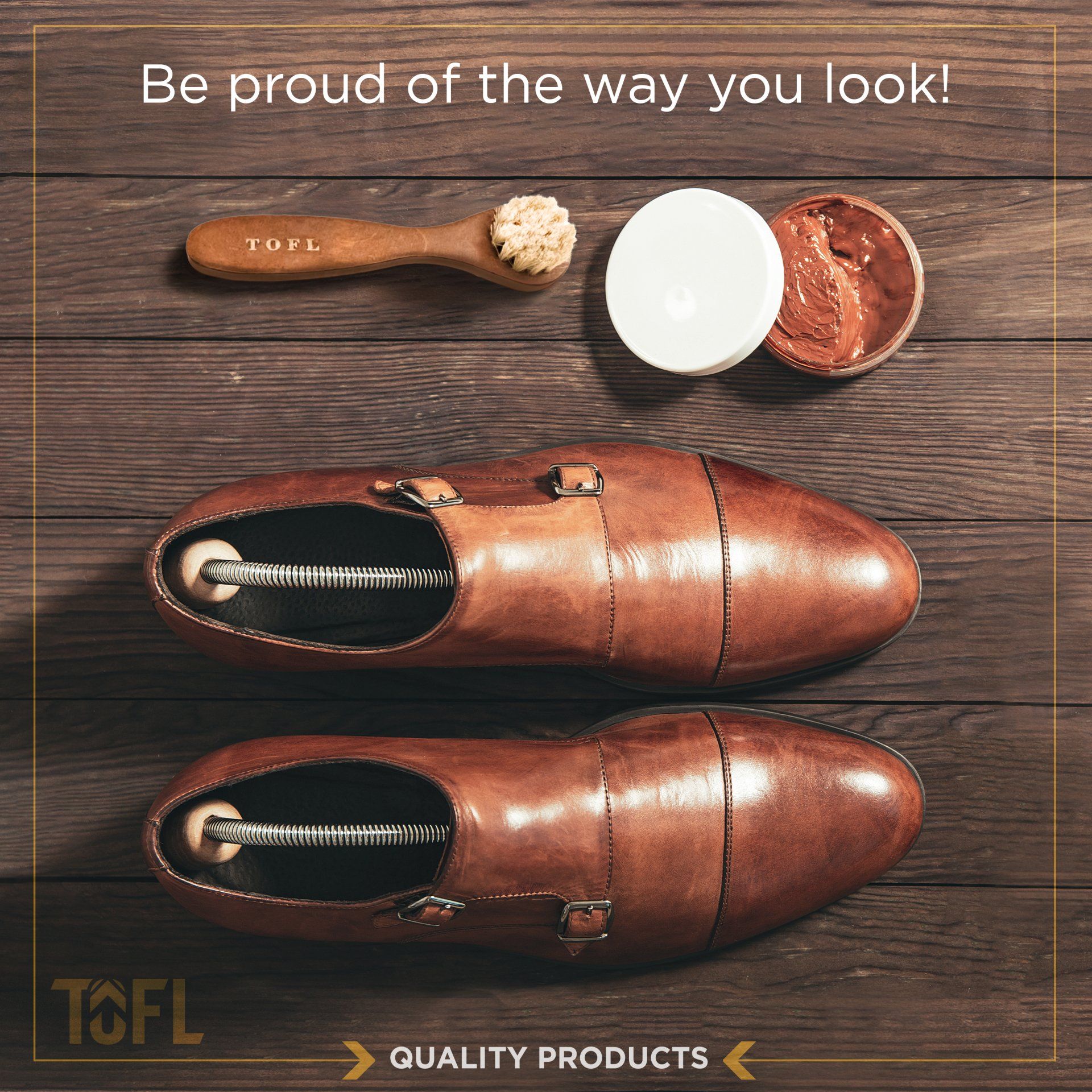 A pair of brown shoes sitting on a wooden table next to a brush and cream.