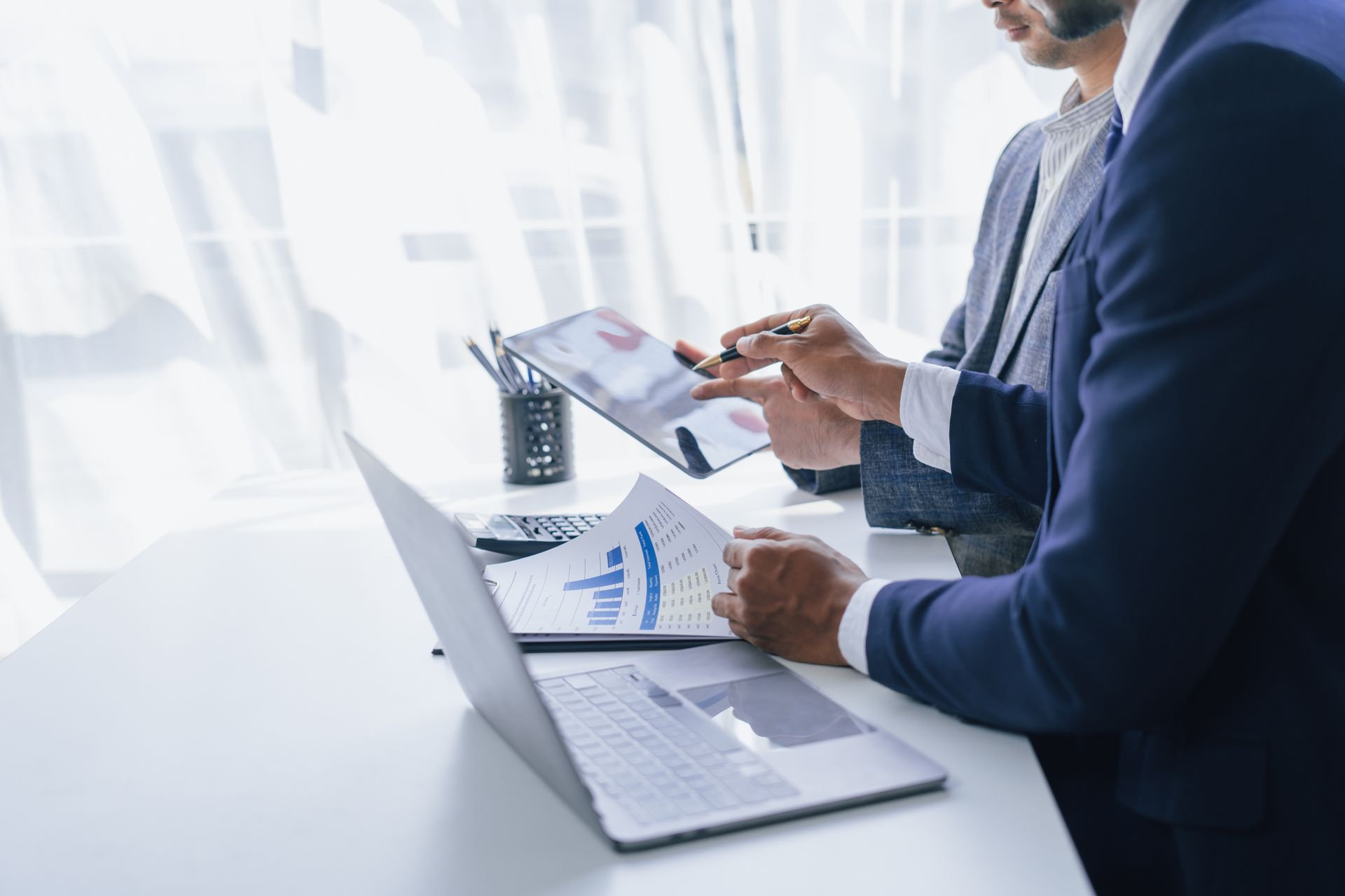 Using tablet pc, Consultant between bookkeepers and accounting lawyer consultation about asset, balance sheet, stock market statistics and yearly tax law, protect business from bribery.