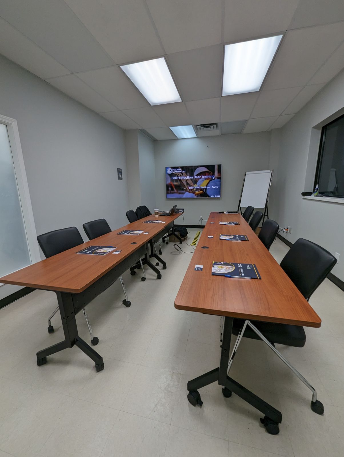 A conference room with a long table and chairs