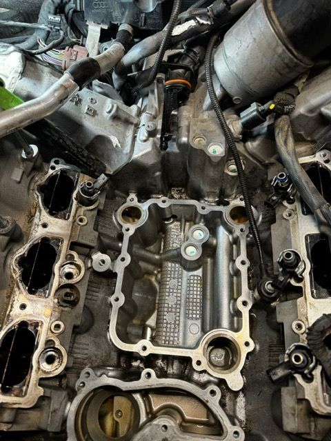 A close up of the inside of a car engine.