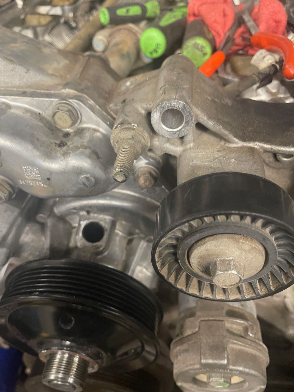 A close up of a belt on a car engine.