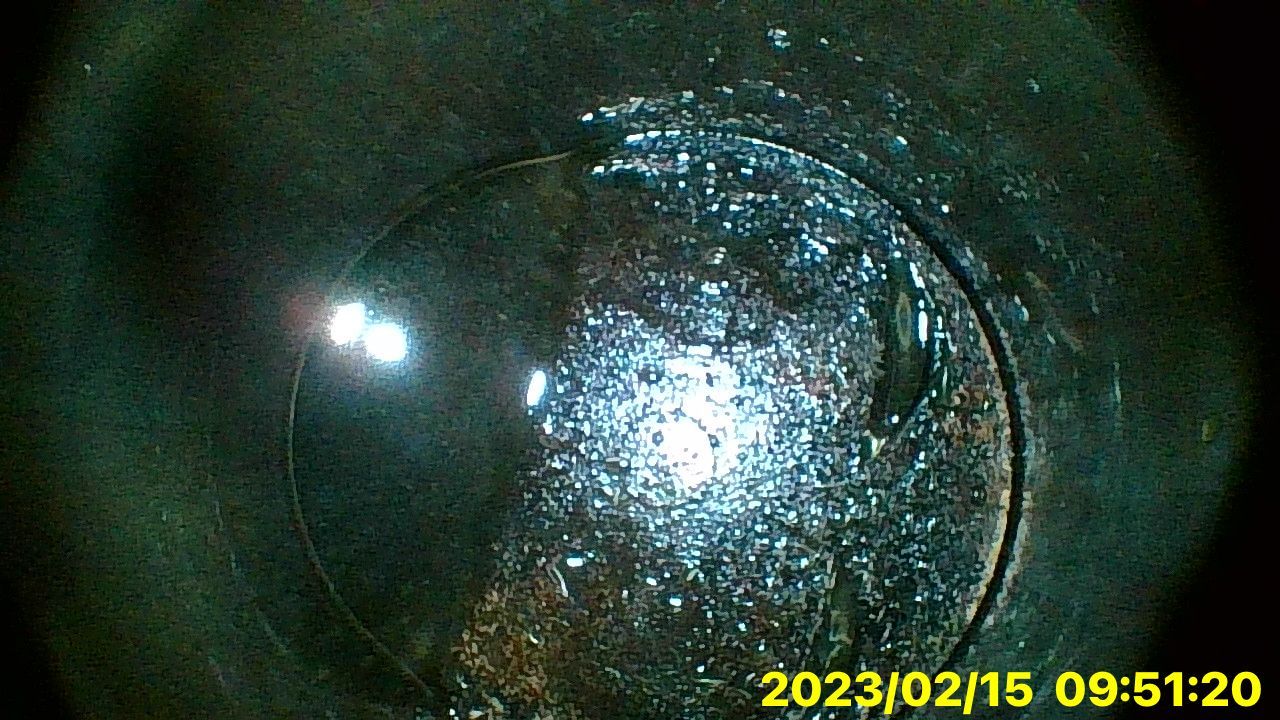 A close up of a glass with a time stamp of 09:51:20 on it.