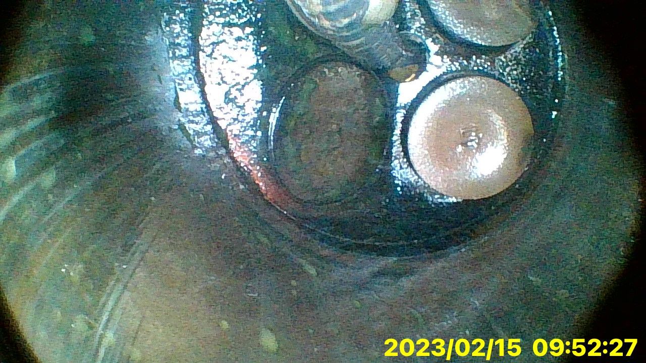 A close up of a metal object with a time stamp of 09:52:27.