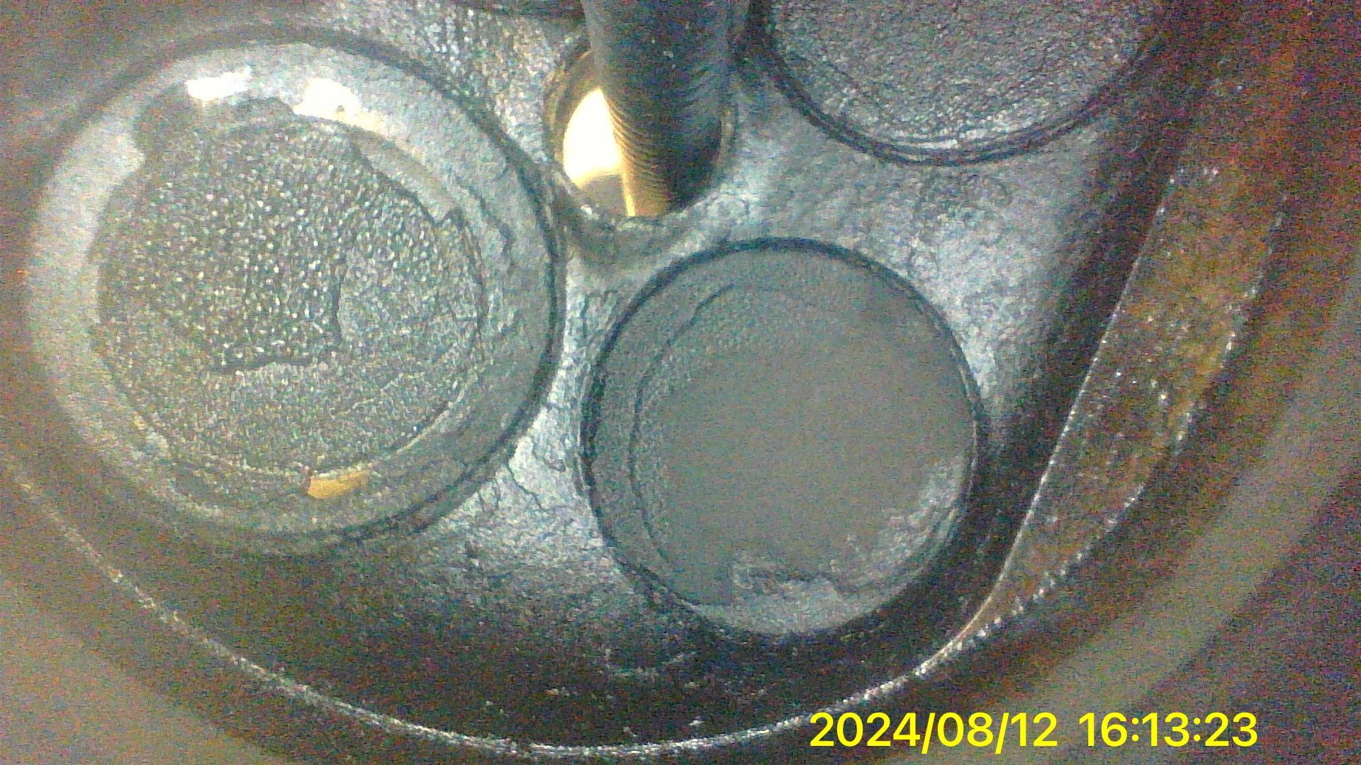 A close up of a metal object with a timestamp of 2024/08/12