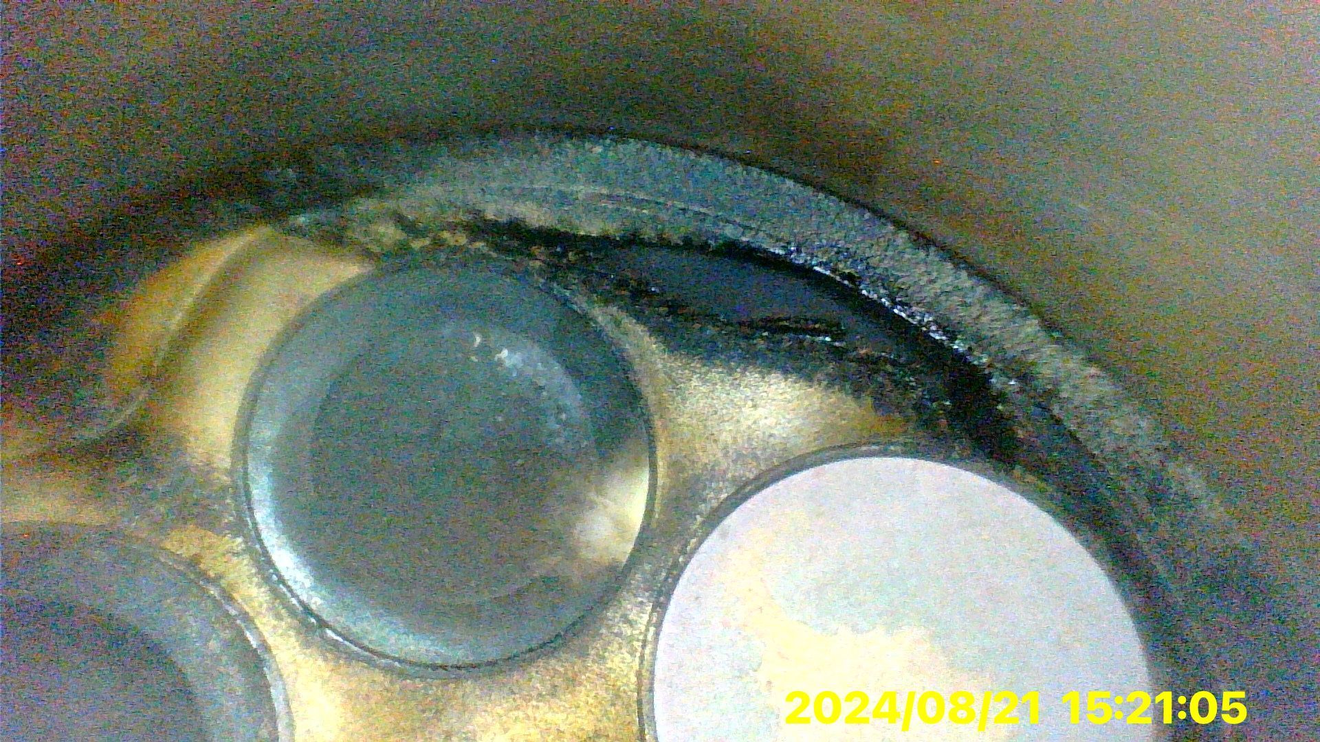 A close up of a metal object with a hole in it.