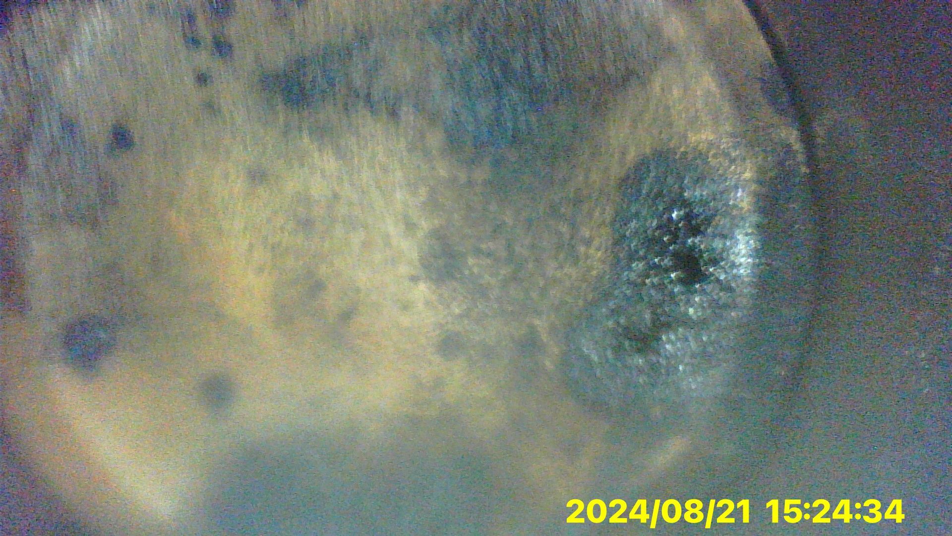 A close up of a piece of metal with a hole in it.