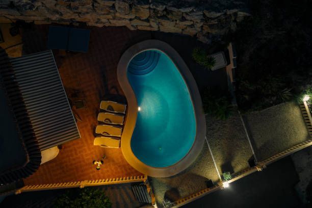 An aerial view of a swimming pool at night.