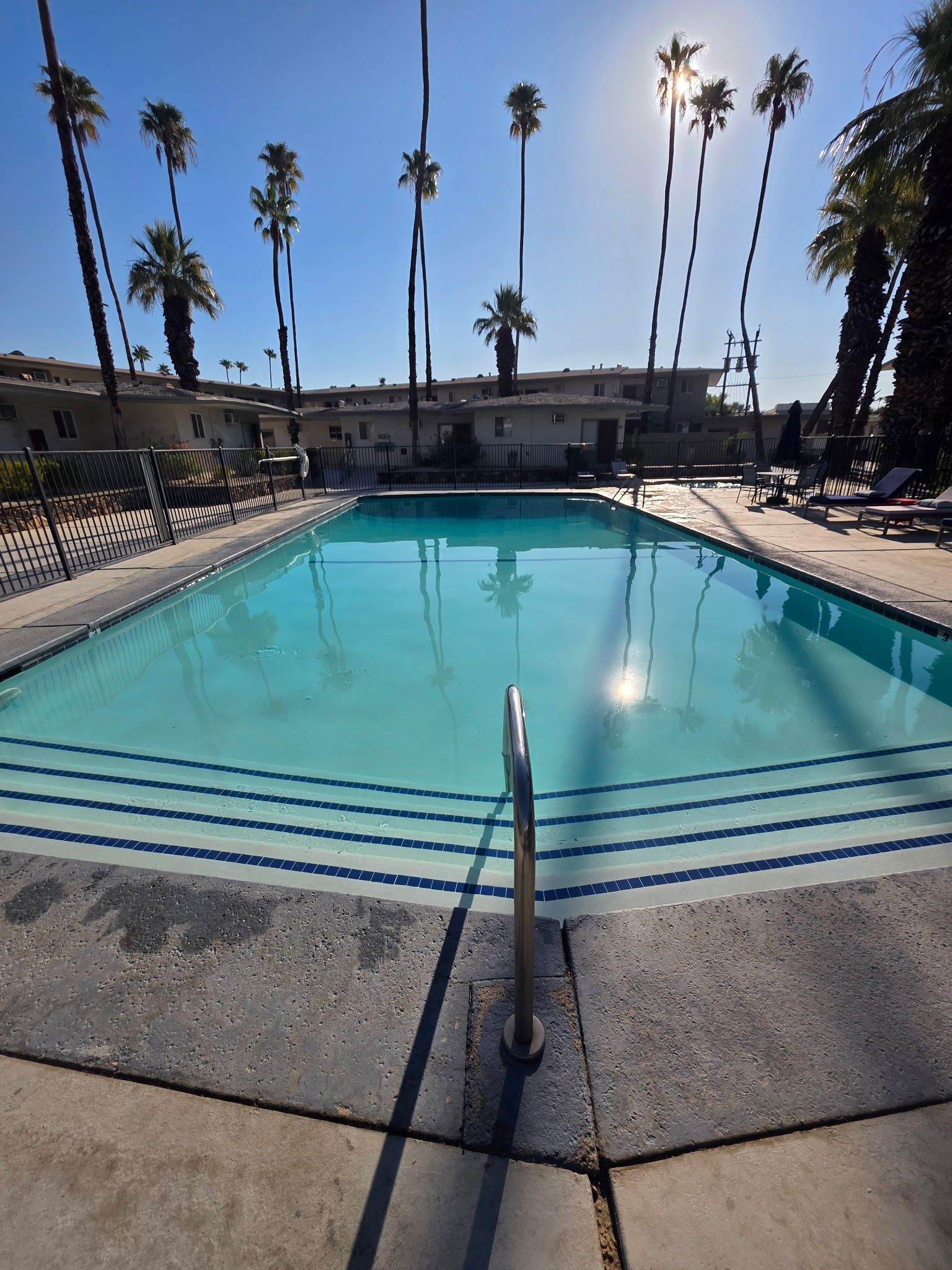 A family is playing in a swimming pool.