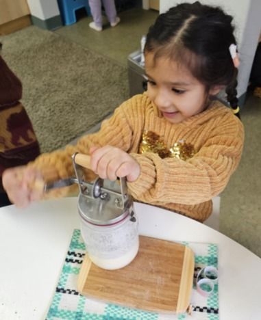 Montessori child working with the Binomial Cube