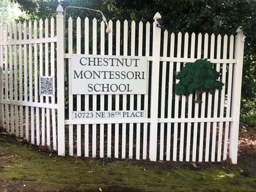 Chestnut Montessori white picket fence
