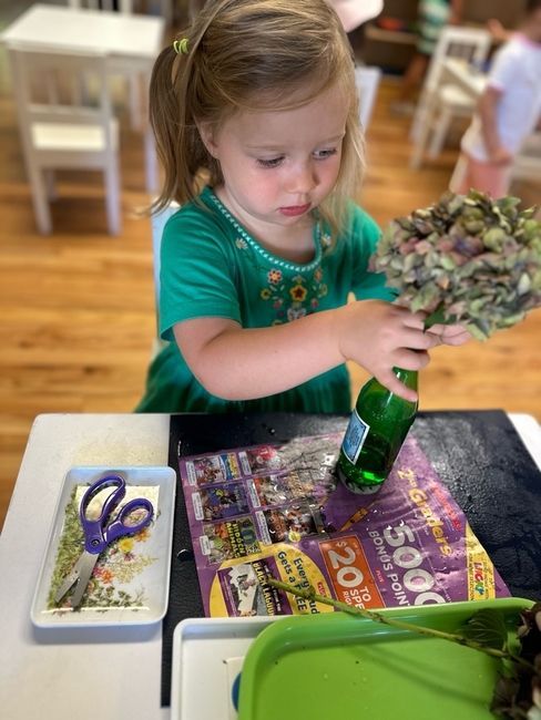 Montessori child working on practical life skills 