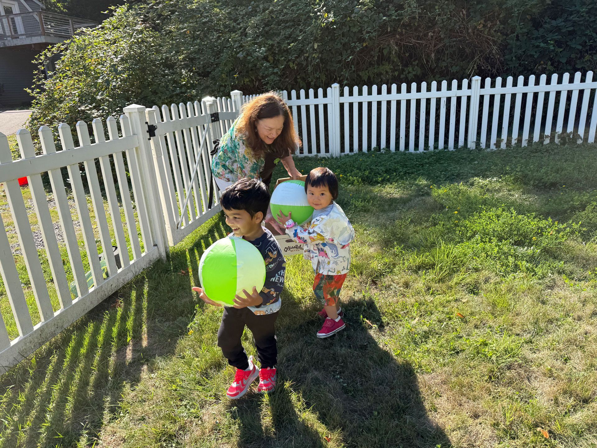 montessori guide with children outside