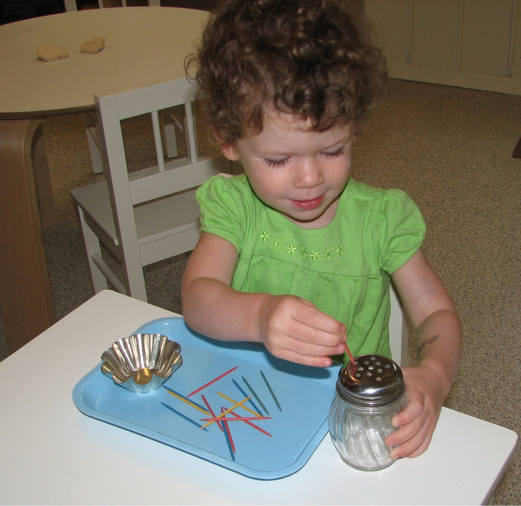 montessori toddler working on practical life skills