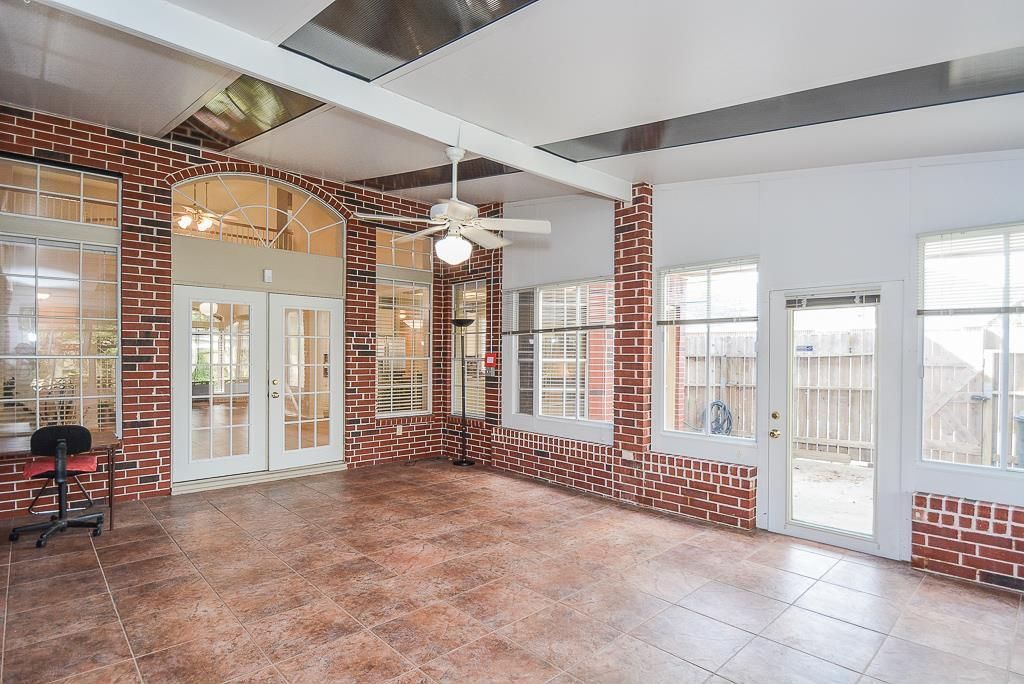Custom glass sunroom with insulated walls built in San Antonio, TX home